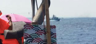 israeli navy ship behind al awda
